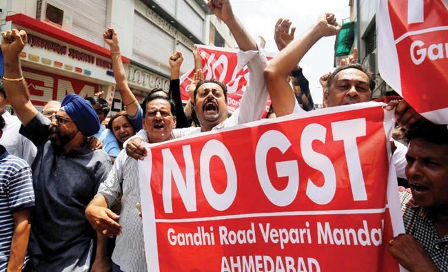 Traders in Ahmedabad shout slogans during a day-long strike against the Goods and Services Tax. (Reuters)