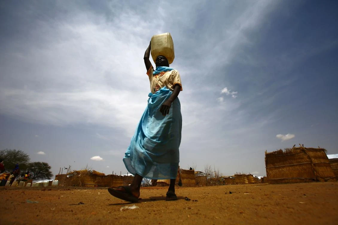 A South Sudanese woman walks at Al-Nimir refugee camp in Sudan's east Dafur on June 20, 2017. South Sudan, which split from the north in 2011, has declared famine in parts of the country, saying a million people are on the brink of starvation. (AFP)