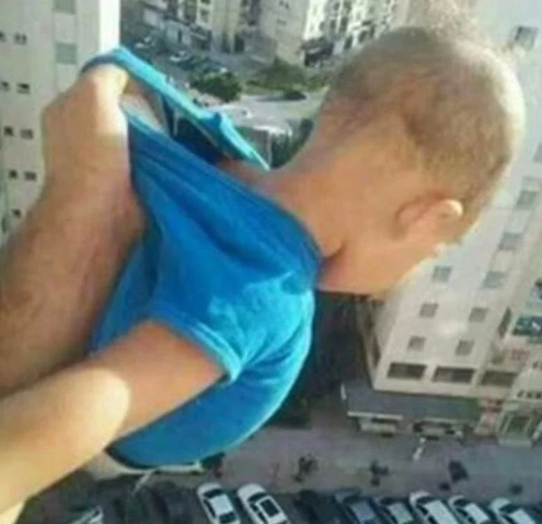 Baby dangled from 15th floor apartment window (Facebook)