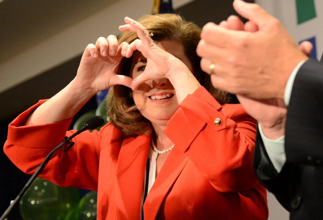Republican Karen Handel makes a heart with her fingers as she speaks to supporters during a brief appearance in Atlanta, Georgia, on Tuesday. (Reuters)