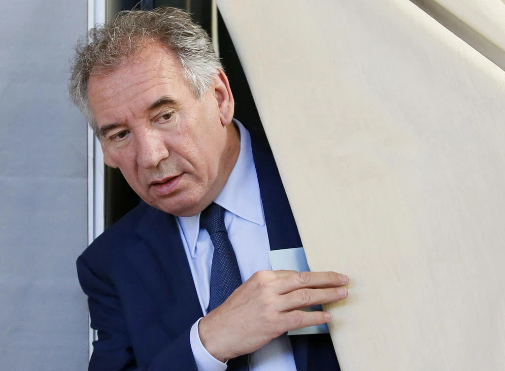 French Justice Minister Francois Bayrou exits a voting booth before casting his ballot in the first round of parliamentary elections in Pau, France. (AP)
