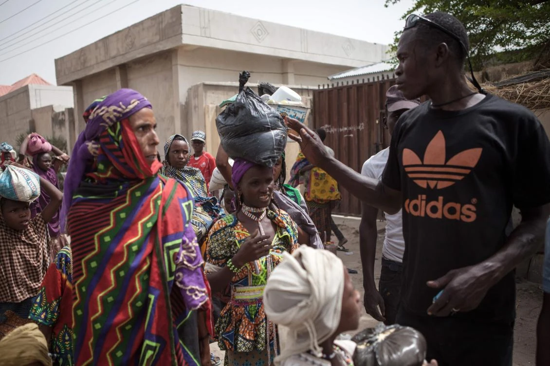A member of Civilian Joint Task Force (CJTF) screening women at the entrance of the town as thousands of Nigerians are returning to their homes in Damasak, in this April file photo. (AFP)