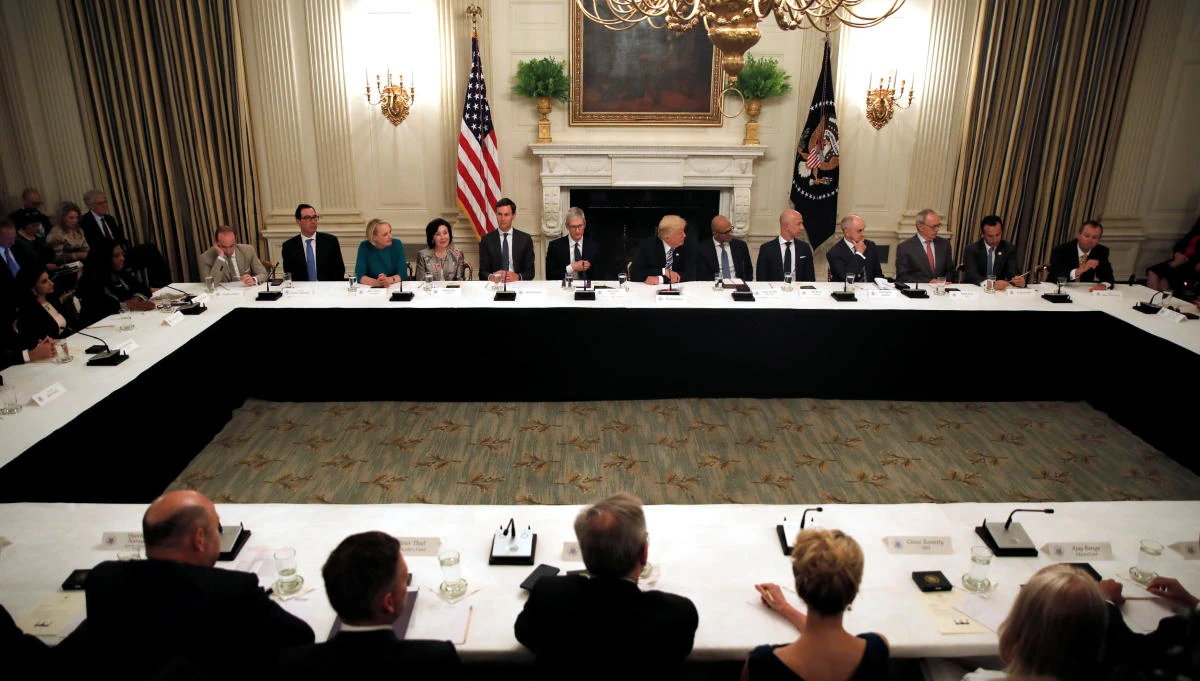 US President Donald Trump (C) participates in an American Technology Council roundtable at the White House in Washington, US. (Reuters)