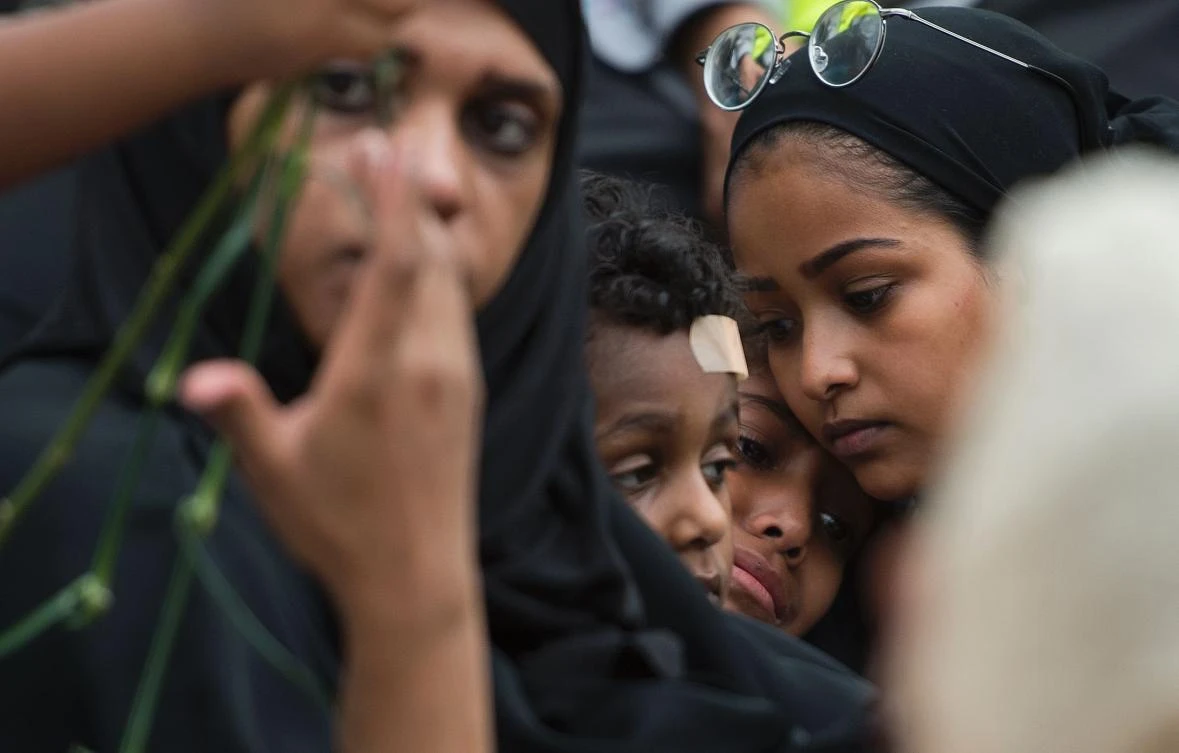TOPSHOT - Family members cry during a vigil in Reston, Virginia, on June 21, 2017, for Nabra Hassanen. The 17-year-old Muslim girl was killed with a baseball bat in a road rage incident on June 18. (AFP)