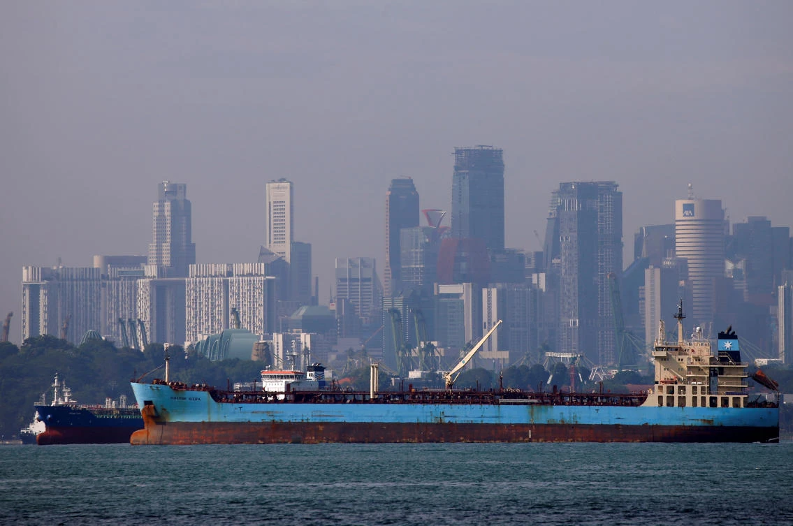 Oil tankers pass the skyline of Singapore in this June 8, 2016 file photo. (Reuters)