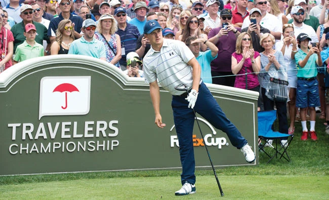 Jordan Spieth watches his drive from the first tee at the Travelers Championship at TPC River Highlands Wednesday in Cromwell, Conn. (AP)