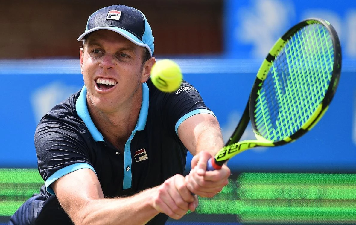 Sam Querrey of the US returns against Australia’s Jordan Thompson during their men’s singles second-round tennis match at the ATP Aegon Championships tennis tournament at Queen’s Club in West London on Thursday. Querrey won 7-6, 3-6, 6-3. (AFP)