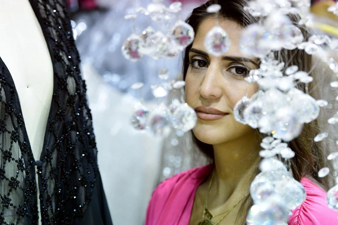 Dubai based fashion designer Aiisha Ramadan is seen in her studio in Dubai. (AFP)