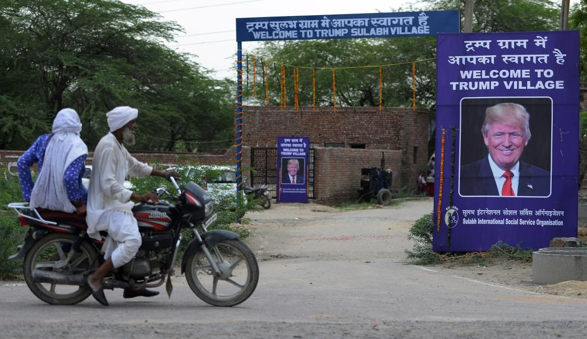 A poster with the image of US President Donald Trump is set up at Marora village, which has been unofficially renamed “Trump Village,” on Friday. (AFP)