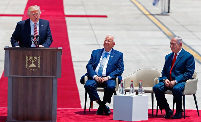 US President Donald Trump (L) speaks as Israeli President Reuven Rivlin and Israeli Prime Minister Benjamin Netanyahu. (AFP)