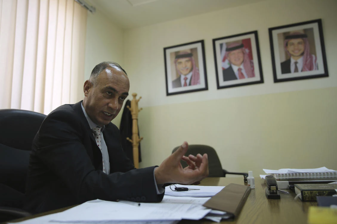 In this June 1, 2017 photo, judge Jehad al-Duradi, who deals with sexual violence cases in Jordan, speaks in an interview in his office in Amman, Jordan. Jordan is on the verge of repealing an article in its penal code that allows a rapist to escape punishment if he marries his victim. Women's activists say this would be a victory, but that much work lies ahead and that women still suffer under patriarchal customs and a legal system that fails to protect victims. (AP)