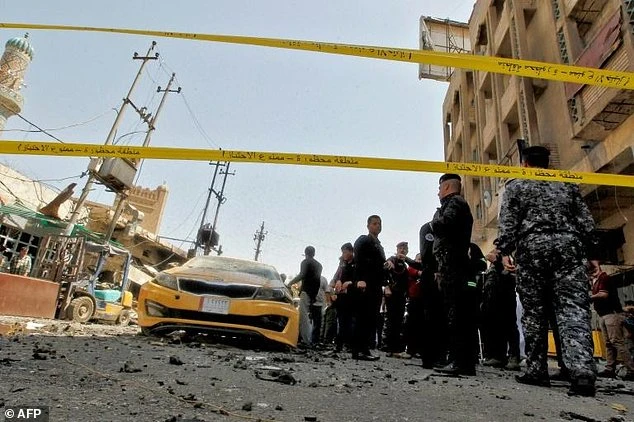 FILE PHOTO: Iraqis gather at the site of bombing on May 30, 2017. (AFP)