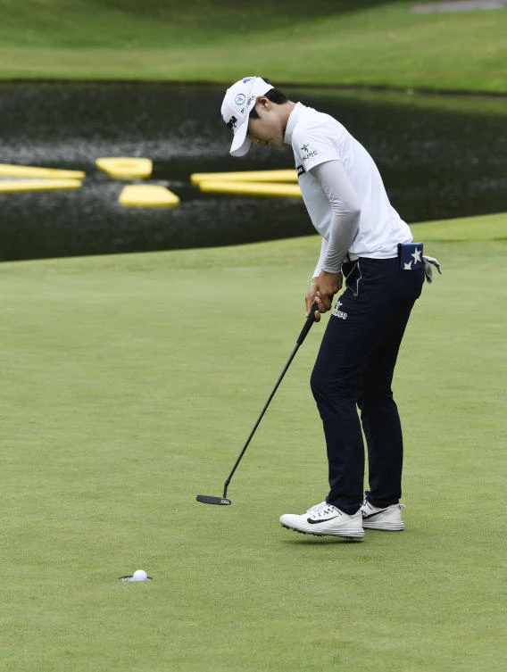 Sung Hyun Park, from South Korea, sinks her put on the 18th green during the LPGA Wal-Mart NW Arkansas Championship golf tournament at Pinnacle Country Club in Rogers, Ark., Friday. (AP)