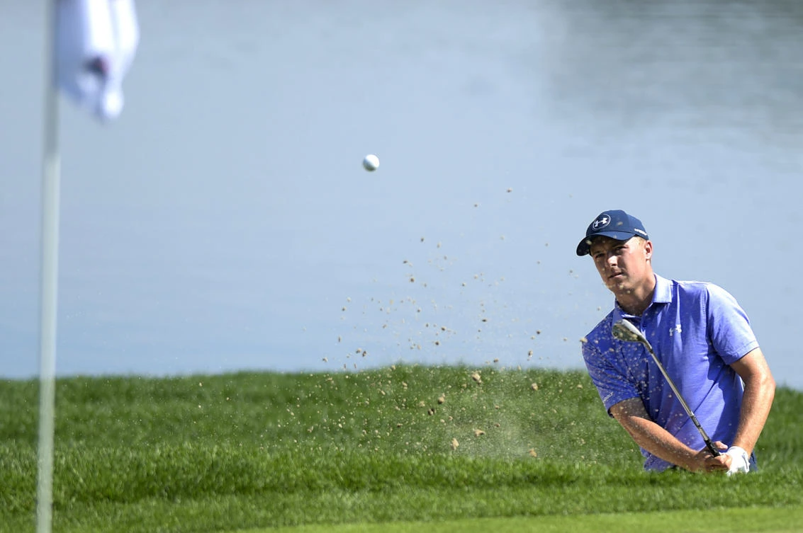 Jordan Spieth blasts out of a bunker on the 16th hole during the second round of the Travelers Championship golf tournament at TPC River Highlands on Friday in Cromwell, Conn. (AP)
