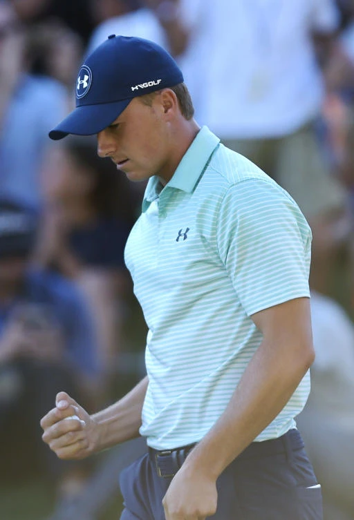 Jordan Spieth pumps his fist after sinking a birdie putt on the18th hole during the third round of the Travelers Championship golf tournament at TPC River Highlands on Saturday in Cromwell, Conn. (AP)