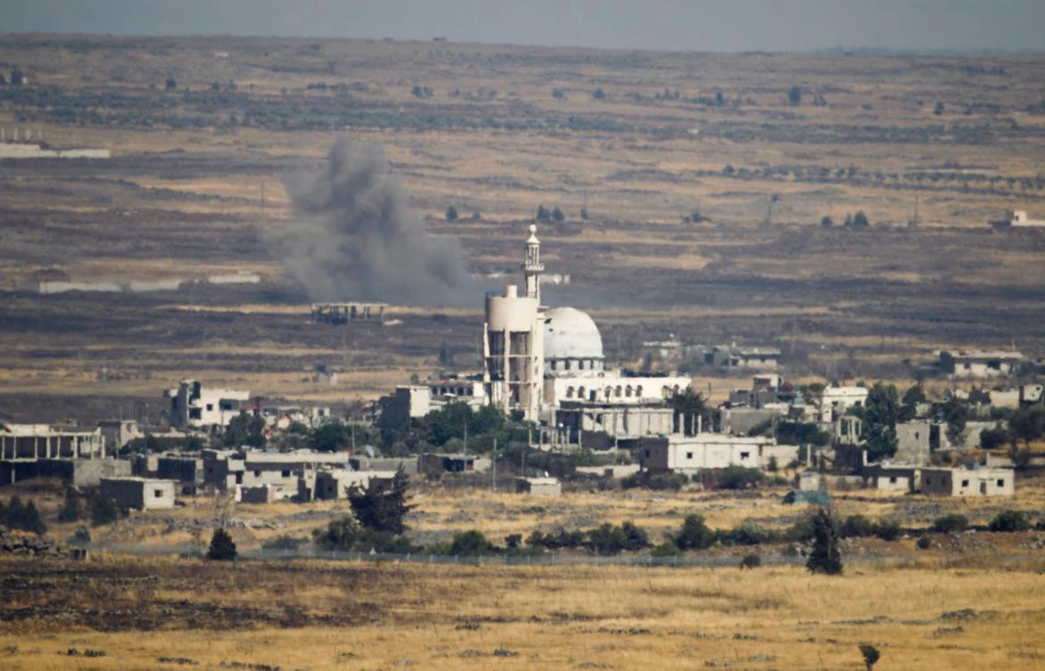 A picture taken from the Israeli-occupied Golan Heights shows smoke billowing from the Syrian side of the border on June 25, 2017. (AFP)