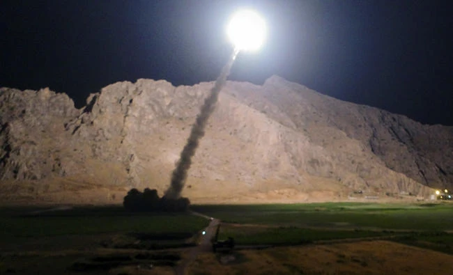 In this file photo released by the Iranian state-run IRIB News Agency on June 19, 2017, a missile is fired from city of Kermanshah in western Iran targeting Daesh positions in Syria. (IRIB News Agency, Morteza Fakhrinejad via AP, File)