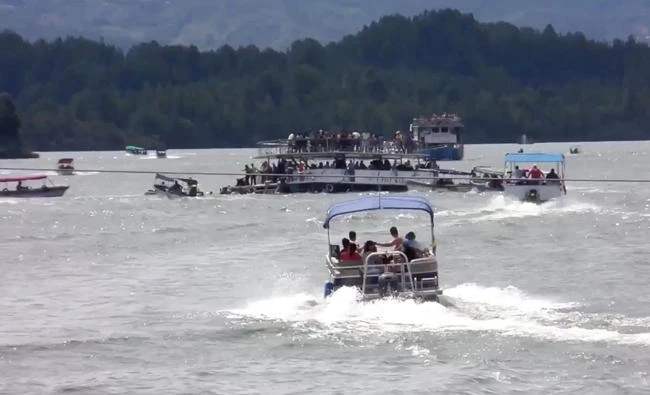 This still image taken from video obtained from social media shows a ferry sinking in the Guatape reservoir near Medellin, Colombia on Sunday. (Louisa Murphy via Reuters)
