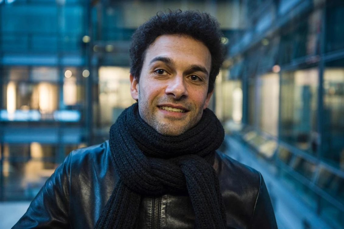 (FILES) This file photo taken on February 12, 2016 shows Egyptian director Tamer El Said posing in an elevator prior to an interview on the sidelines of the Berlinale Film Festival in Berlin. Everyone thought Tamer El Said had gone mad in the decade it took him to make his film "In the Last Days of the City". He soldiered on even as the Egyptian revolution and counter-revolution seemed to have swept his years of agony and effort into irrelevance. (AFP)