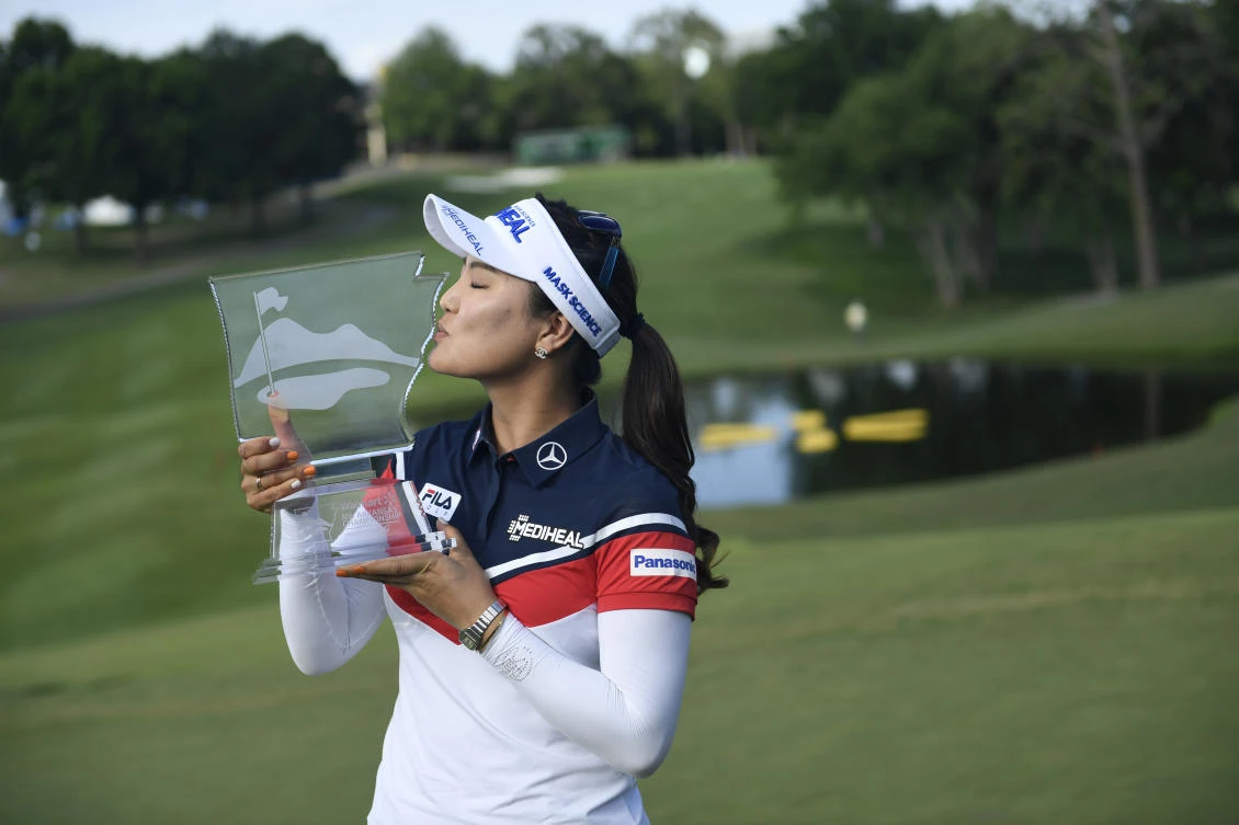 So Yeon Ryu, from South Korea, kisses her trophy for photographers after winning the LPGA Wal-Mart NW Arkansas Championship golf tournament at Pinnacle Country Club in Rogers, Ark., Sunday. (AP)