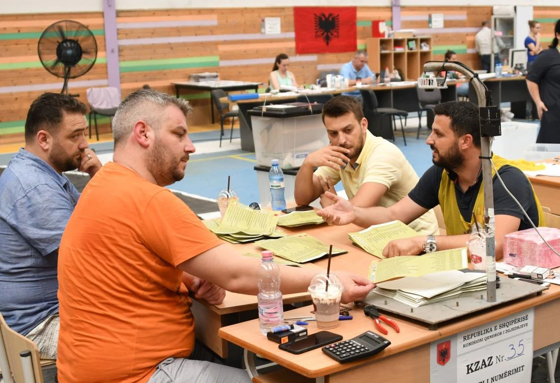 Election officials count votes of the general election in Albania, which could determine its chances of joining the EU, in Tirana on Monday. (AFP)