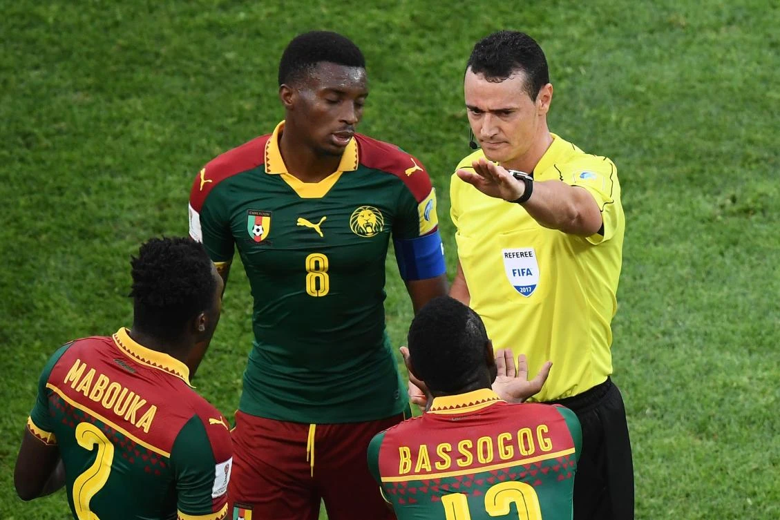 Colombian referee Wilmar Roldan, right, sends off Cameroon's defender Ernest Mabouka, left, after a foul during the 2017 FIFA Confederations Cup group B football match between Germany and Cameroon at the Fisht Stadium Stadium in Sochi on Sunday. (AFP)