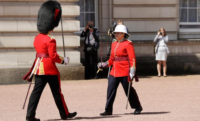 Canadian Capt. Megan Couto, right, takes part in the changing of the guard ceremony at Buckingham Palace. (AP)