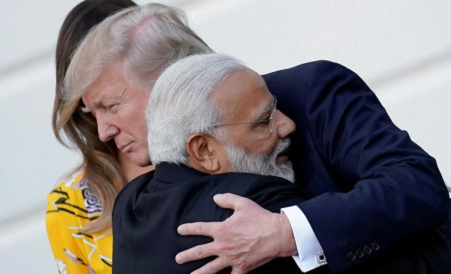 India's Prime Minister Narendra Modi hugs US President Donald Trump as he departs from the White House in Washington, D.C. on Monday. (REUTERS/Carlos Barria)
