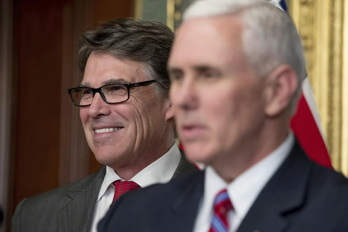 FILE- In this March 2, 2017, file photo, Vice President Mike Pence, right, speaks before administering the oath of office to Energy Secretary Rick Perry, left, in the Eisenhower Executive Office Building on the White House complex in Washington. Perry said Monday, June 26, that the Trump administration is confident officials can "pave the path toward U.S. energy dominance" by exporting oil, gas and coal to markets around the world, and promoting nuclear energy and even renewables such as wind and solar power. (AP)