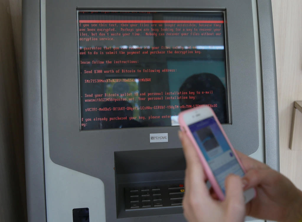 A message demanding money is seen on a monitor of a payment terminal at a branch of Ukraine's state-owned bank Oschadbank after Ukrainian institutions were hit by a wave of cyber attacks earlier in the day, in Kiev, Ukraine. (Reuters)