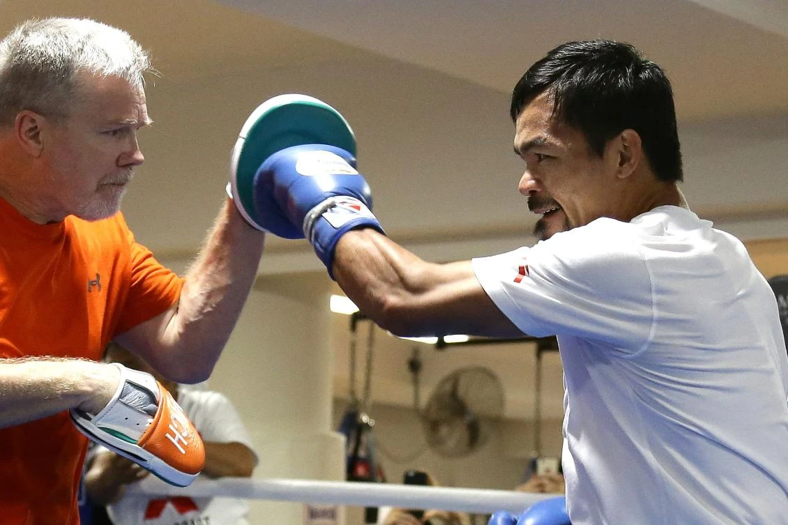 Filipino boxer Manny Pacquiao spars with his trainer Freddie Roach during a training session in Brisbane on Tuesday in preparation for his upcoming WBO welterweight title defense against Australian challenger Jeff Horn. The title bout between Pacquiao and Horn is scheduled to be held on July 2. (AFP)