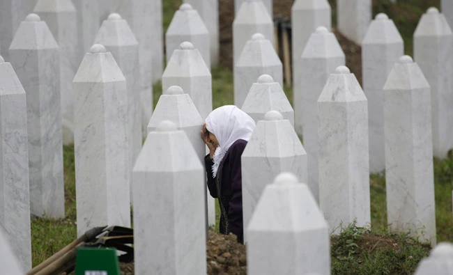 In this file photo, a bosnian muslim woman cries at the grave of her relative killed in the 1995 Srebrenica massacre. A Dutch appeals court ruled on Tuesday, that the government was partially liable in the deaths of some 350 Muslim men killed by Bosnian Serb forces in the Srebrenica massacre. (AP)