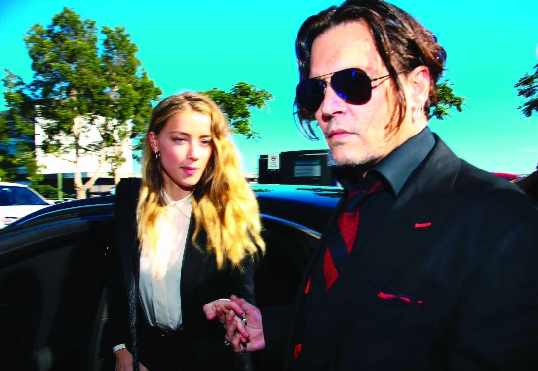 US actor Johnny Depp, right, and his former wife
Amber Heard arrive at court in Australia
in this April 18, 2016 file photo. (AFP)