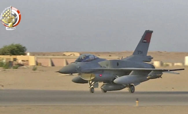 In this still image taken from video provided by the Egyptian military, An Egyptian fighter jet takes off from an undisclosed location in Egypt to strike militant hideouts in the Libyan city of Darna on May 26, 2017. (Egyptian military via AP)