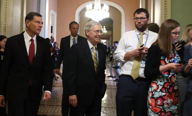 US Senate Majority Leader Mitch McConnell walks up to announce a delay in the health care vote on Capitol Hill in Washington, DC on Tuesday. The Republican-led Senate could not get enough votes to pass the measure. (Mark Wilson/Getty Images/AFP)