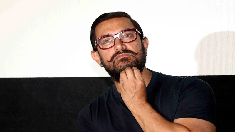 Indian Bollywood actor Aamir Khan looks on during a promotional event for the forthcoming Hindi film 'Dangal' directed by Nitesh Tiwari in Mumbai on November 12, 2016. (AFP)