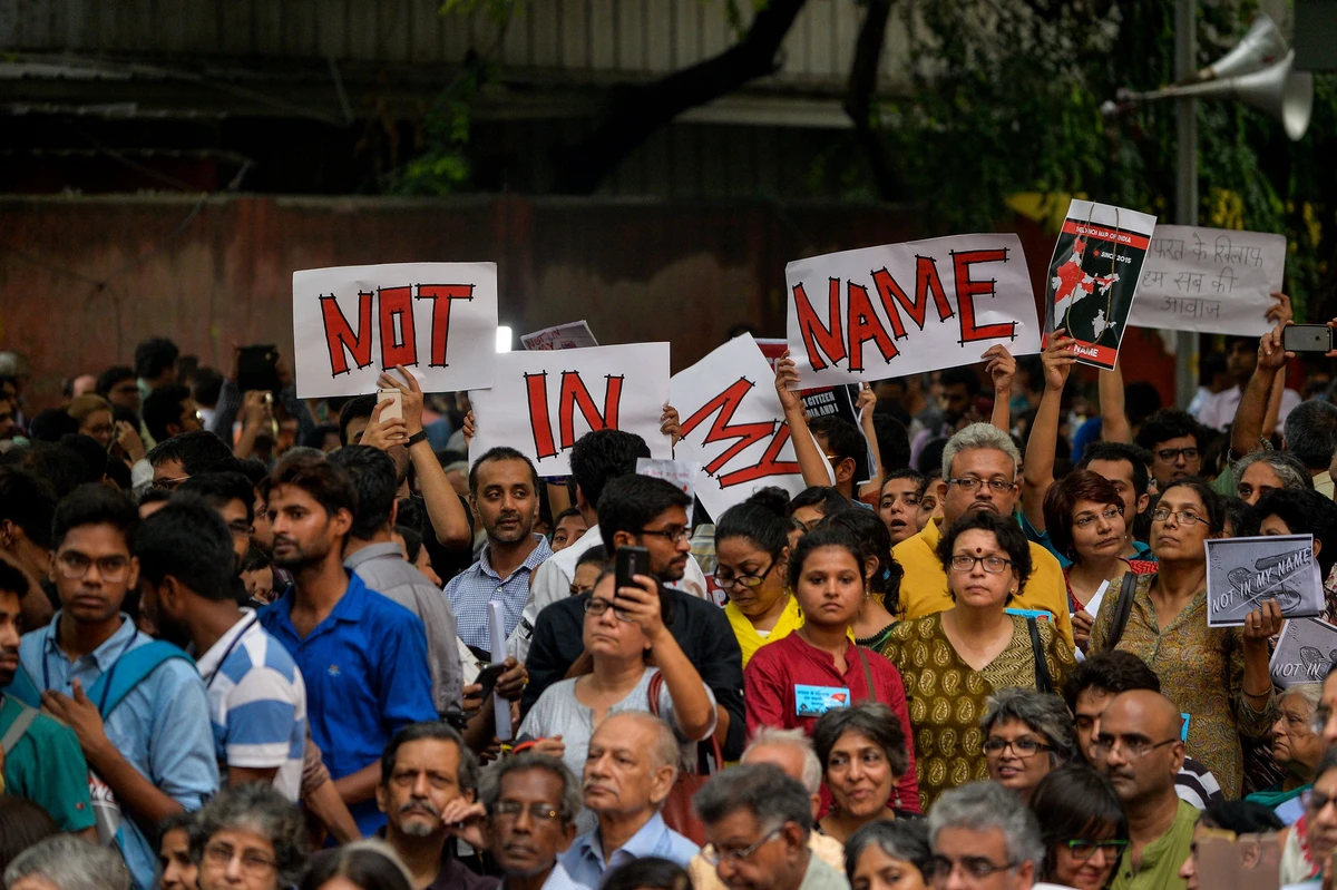 Indian protesters hold placards as they gather during a 'Not in my name' silent protest at Jantar Mantar in New Delhi on June 28, 2017, following a spate anti-Muslim killings. A mob stabbed a Muslim teenager Junaid Khan, 15, who was travelling from New Delhi on June 24 with three of his brothers when a fight erupted over seats. The incident is the latest such attack by Hindu vigilantes in India, where there have been a spate of assaults against Muslims and low-caste Dalits. (AFP)