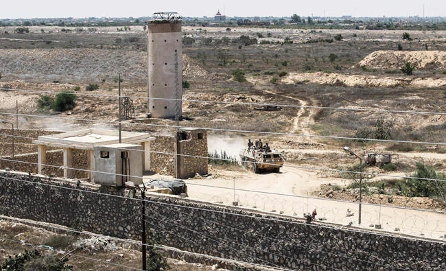 Egyptian border guards patrolling on the other side of Gaza border-town of Rafah on Wednesday. (AFP)