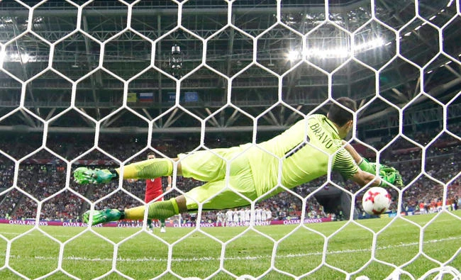 Chile goalkeeper Claudio Bravo makes a save in the shootout of the Confederations Cup semifinal soccer match between Portugal and Chile at the Kazan Arena, Russia, Wednesday. (AP)