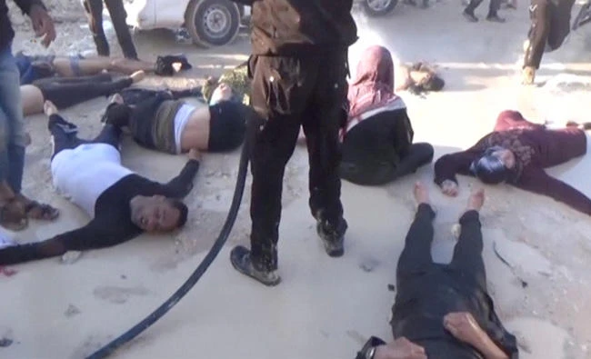 A still image taken from a video posted to a social media website on April 4, 2017, shows people lying on the ground, said to be in the town of Khan Sheikhoun, after what rescue workers described as a suspected gas attack in rebel-held Idlib, Syria. (Reuters file photo)
