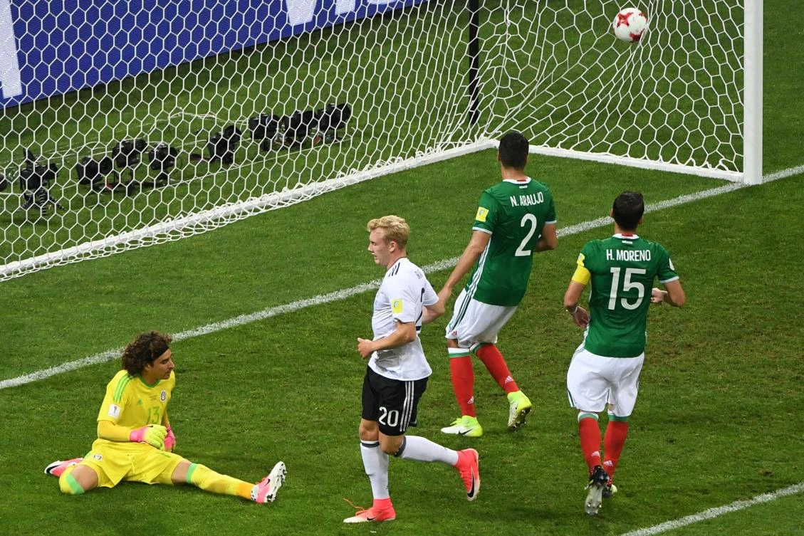 Mexico's goalkeeper Guillermo Ochoa (L) concedes a fourth goal during the 2017 Confederations Cup semi-final football match between Germany and Mexico at the Fisht Stadium in Sochi on Thursday. (AFP / Patrik Stollarz)