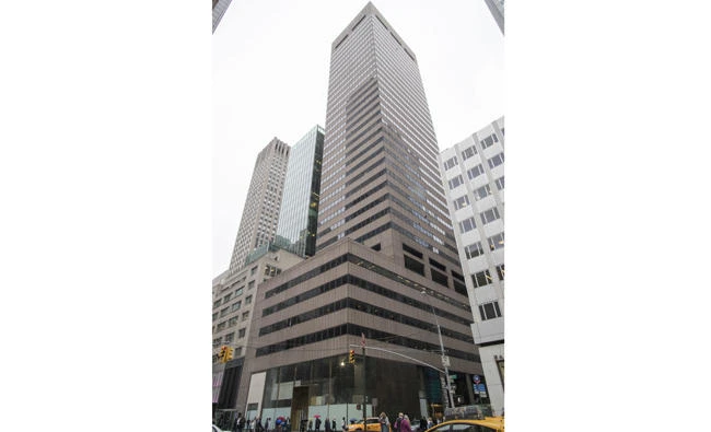 This May 30, 2017 file photo shows 650 5th Avenue in New York. A jury found on Thursday that the ownership of the Manhattan skyscraper by an Iranian-American charity was derived from financial dealings that violated sanctions against Iran. (AP Photo/Mary Altaffer, file)