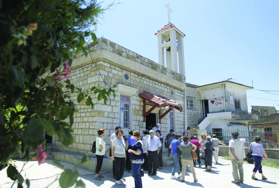 Christians attend mass at a church in the Druze village of Ein Qiniye in the occupied Golan Heights in this June 11 photo. (AFP)