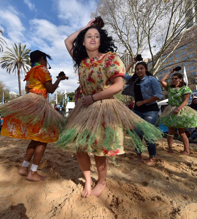 Participants perform a traditional Aboriginal dance at Sydney's Hyde Park on July 3, 2017. The week long annual event, with the theme of 'our languages matter', celebrates Aboriginal and Torres Strait Islander culture and takes place from July 3 in Hyde Park. / AFP / SAEED KHAN