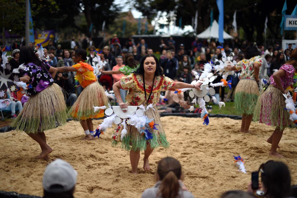 Participants perform a traditional Aboriginal dance at Sydney's Hyde Park on July 3, 2017. The week long annual event, with the theme of 'our languages matter', celebrates Aboriginal and Torres Strait Islander culture and takes place from July 3 in Hyde Park. / AFP / SAEED KHAN