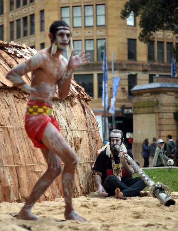 Traditional Aboriginal dancers perform at Sydney's Hyde Park on July 3, 2017. The week long annual event, with the theme of 'our languages matter', celebrates Aboriginal and Torres Strait Islander culture and takes place from July 3 in Hyde Park. / AFP / SAEED KHAN