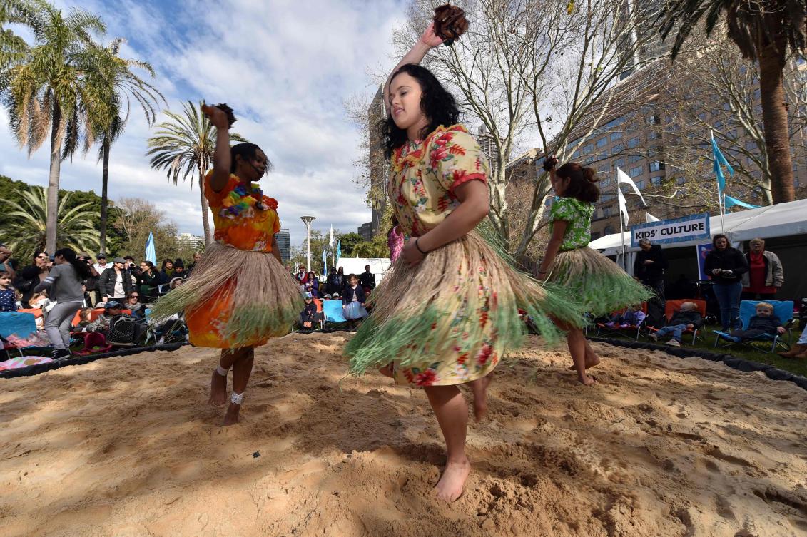 Participants perform a traditional Aboriginal dance at Sydney's Hyde Park on July 3, 2017. The week long annual event, with the theme of 'our languages matter', celebrates Aboriginal and Torres Strait Islander culture and takes place from July 3 in Hyde Park. / AFP / SAEED KHAN