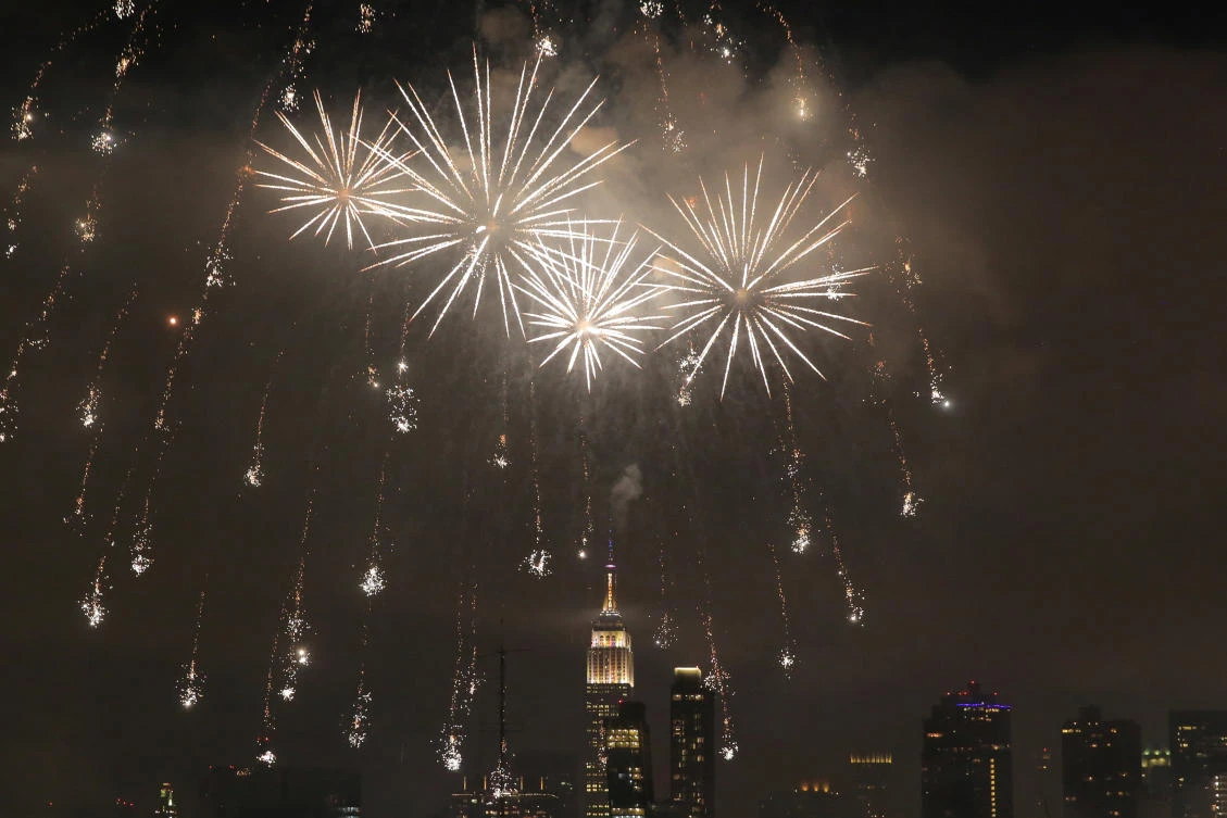 The Empire State Building is seen behind the Macy's 4th of July Firework Show in Manhattan, New York City, U.S., July 4, 2017. REUTERS/Andrew Kelly