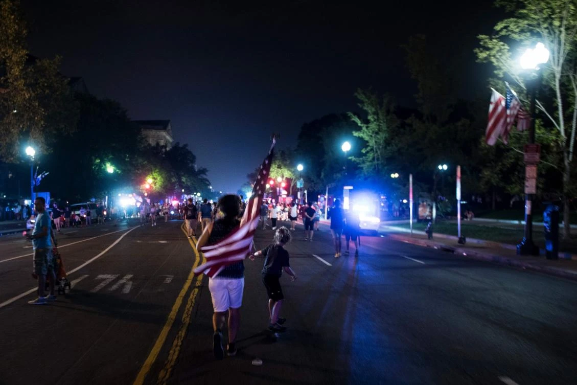 People leave after fireworks on US independence day on July 4, 2017 in Washington, DC. / AFP / Brendan Smialowski