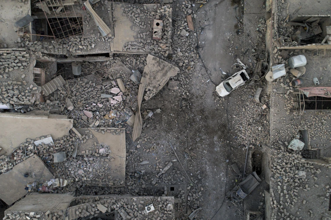 In this July 13, 2017 photo, aerial view of a destroyed street on the west side of Mosul, Iraq. Iraq’s U.S.-backed forces succeeded in wresting Mosul from the Islamic State group but at the cost of enormous destruction. The nearly 9-month fight culminated in a crescendo of devastation _ the blasting of the historic Old City to root out the militants’ final pockets. (AP Photo/Felipe Dana)